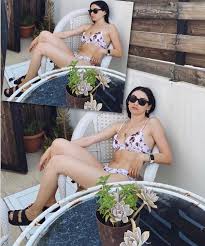 Hazar Ergüçlü smiles naked