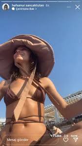 Hazar Ergüçlü smiles ass