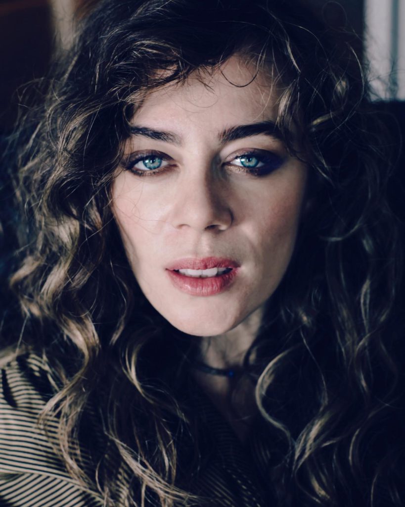 Demet Evgar poses boobs