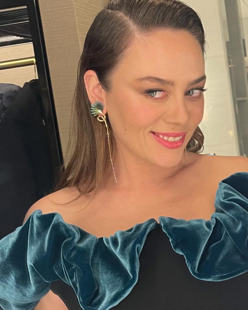 Demet Evgar poses naked