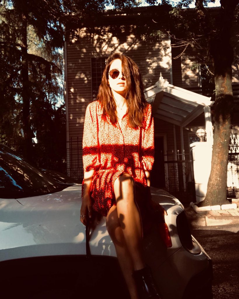 Demi Rose modeling boobs