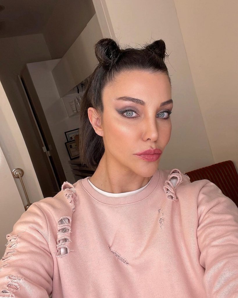 Deniz Akkaya smiles sexy