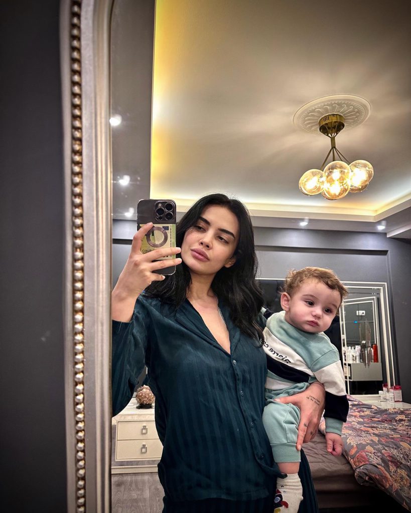 Ece Ronay smiles boobs