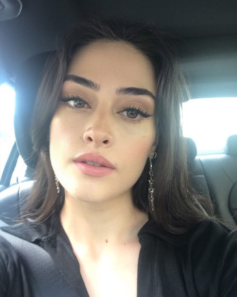 Esra Bilgiç depicts fire nude