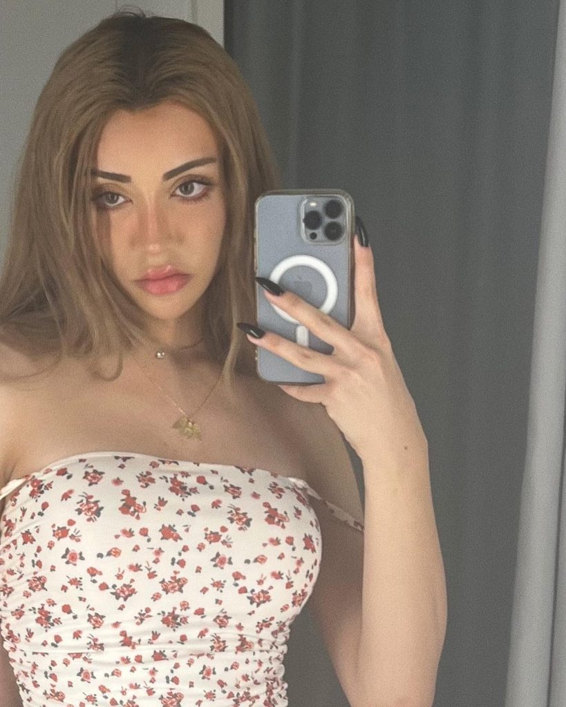 Mika Raun smiles naked